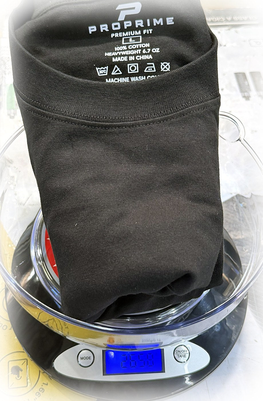 ProPrime black t-shirt size L on a kitchen scale reading 265.8 grams